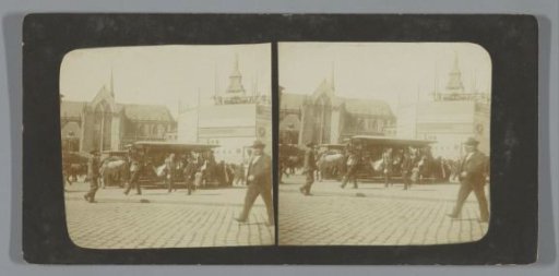 Passers-by and horse trams on the Dam with the statue 'De Eendracht', better known as 'Naatje van de Dam' (in the scaffolding), Amsterdam, Netherlands