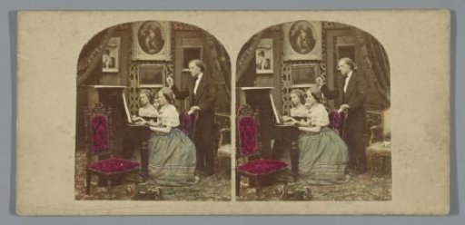 Two Girls Receiving Piano Lessons from a Music Teacher