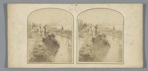 Laborers with wheelbarrows at a construction site in Edingen, Belgium