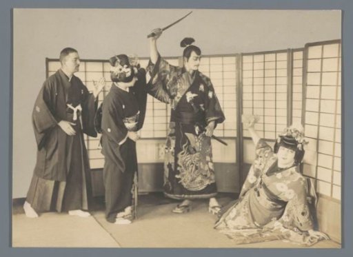 Two men and two women in kimono, Japan