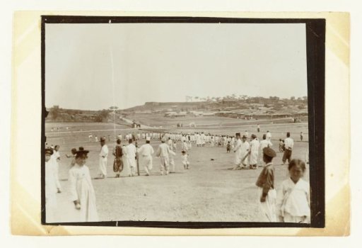 Rolling landscape with a village and especially people dressed in white, Korea