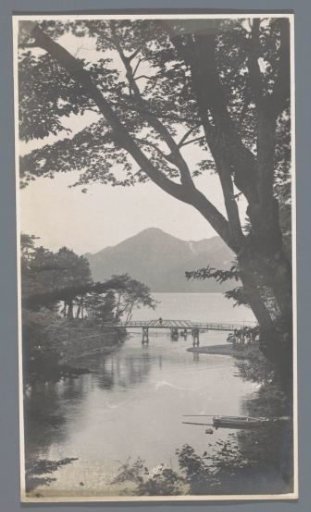 View of a lake with wooded banks and mountains in the background, Nikko, Japan
