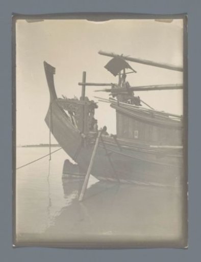 View of the Stern of a Ship Decorated with Woodcarving in a River, Southeast Asia