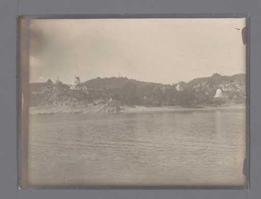 Various (Buddhist?) temples on a river, South-East Asia
