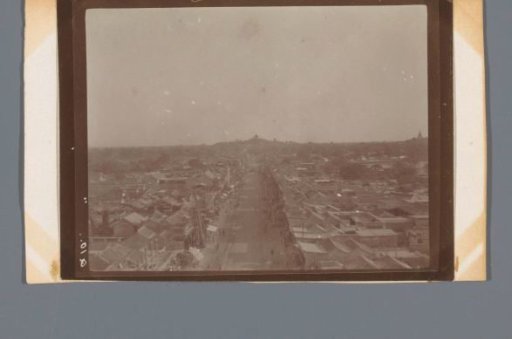 Bird's-eye view of an elongated shopping street in a vast city, China