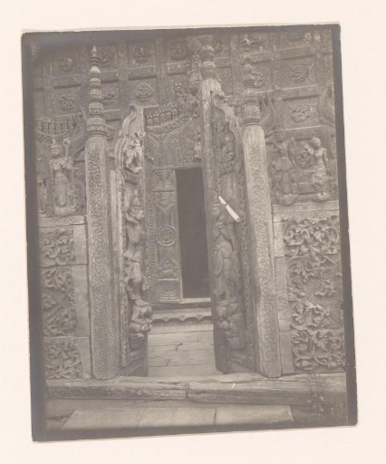 Entrance door of a shrine with wooden carvings, Myanmar