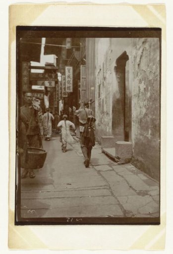 A street with a few people in Kinkiang, China