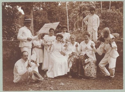Group portrait of cheerful people in Batuan, dressed in white.