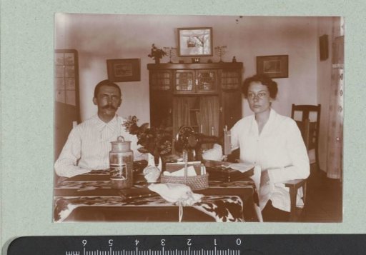 Portrait of a man and woman at a table.