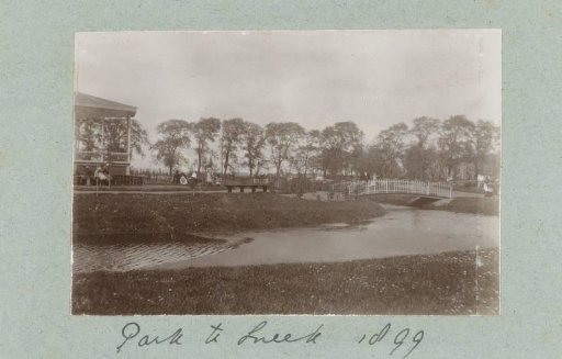 Park with a bridge and pedestrians