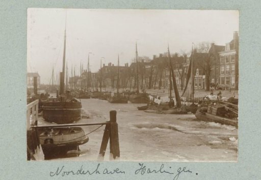 Harbour view with flat-bottomed boats and frozen water