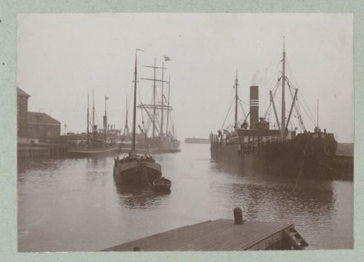 Steamboats and sailing ships in the harbor of Harlingen