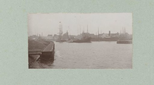 Harbor view in Harlingen with steam and sailing ships