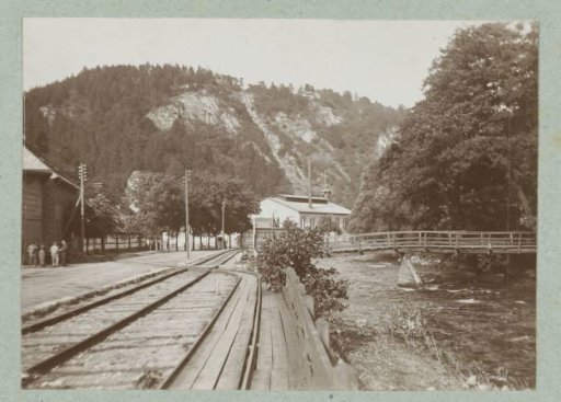 Railway and river view against the background of a wooded mountain landscape near the Rübeland station