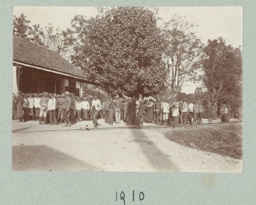 Row of Indonesian workers in front of one of the factory buildings