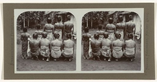 Nine women in sarongs with their backs to the camera.