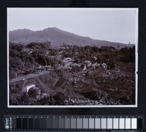 A Village Scene with Constructed Terraces Against the Background of a Mountain Landscape