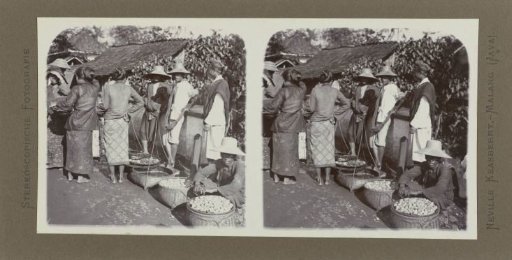 Sale of fruits and fish in woven baskets at a market