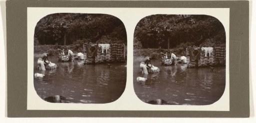 People washing clothes on stones in the river