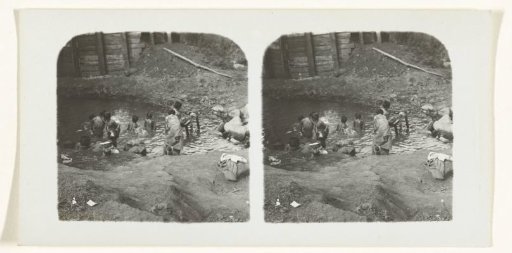 Bathing and washing women and children in calm water
