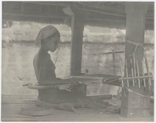 Young woman with a loom