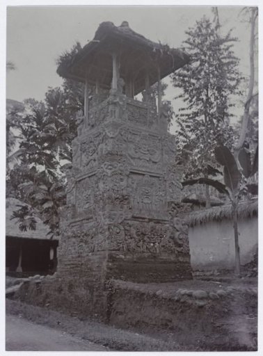 A decorated tower near a temple complex