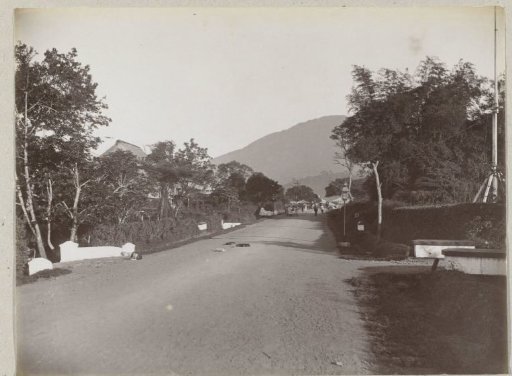 Street view in Padang Pandjang with a view of the Marapi volcano