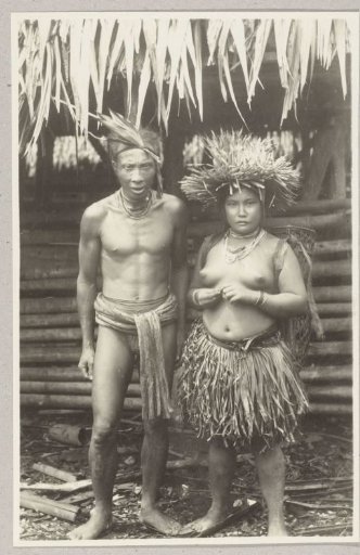 Portrait of an unknown man and woman in Mentawai dress