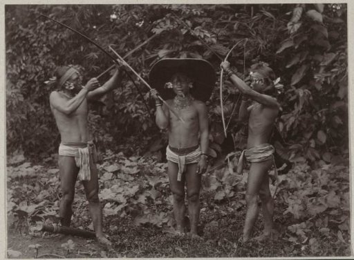 Group portrait of three unknown hunters on the Mentawai Islands