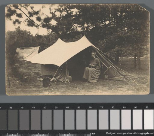 Portrait of an unknown woman in front of a tent