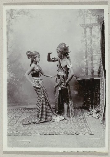 Studio portrait of two Javanese dancers in traditional clothing and makeup