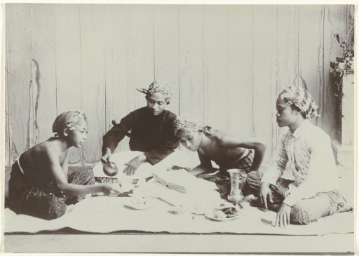 Four Young Men Drinking Coffee or Tea