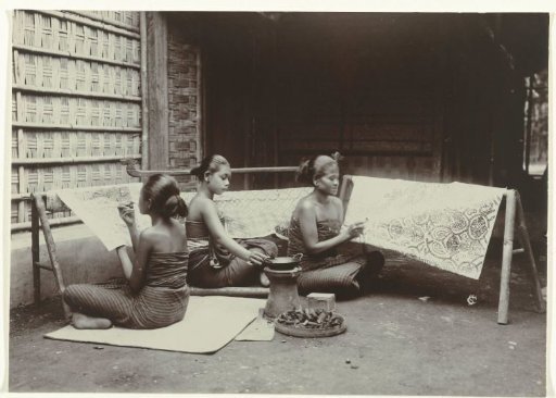 Three Javanese women drawing batik patterns