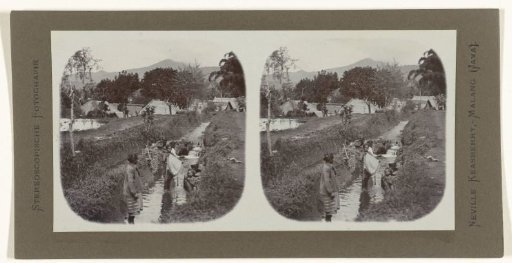Women washing clothes in a stream on Java