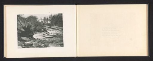 View of a rocky coast with a rowing boat in probable Maine
