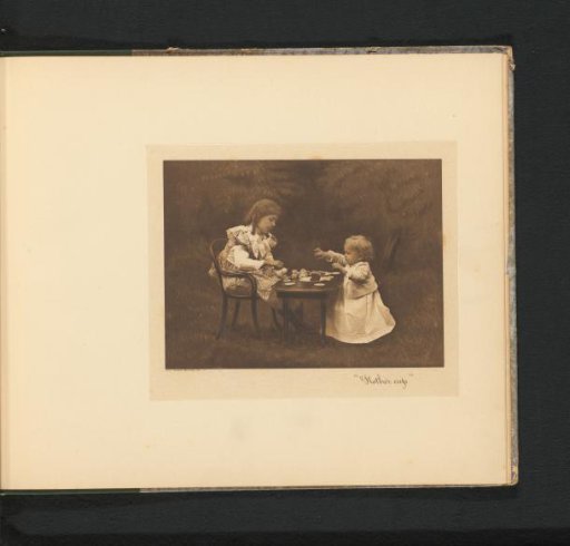 Two girls at a table in a garden, the eldest pouring tea into a cup of a toy tea set