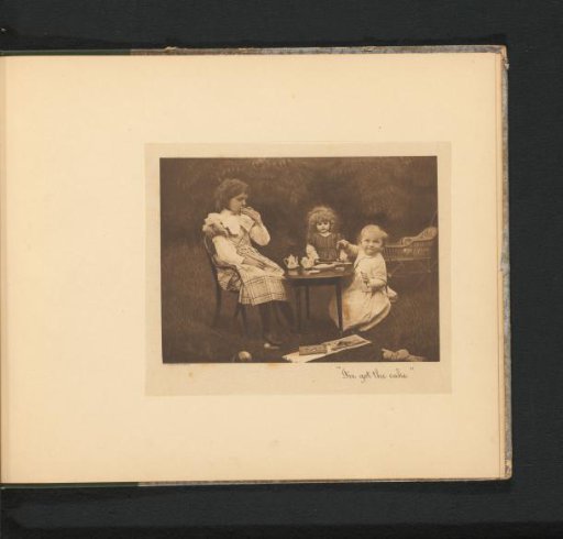 Two girls at a table in a garden with a toy tea set, a doll carriage, a doll and books around them