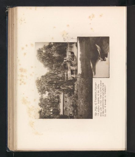 View of a watermill at Sleepy Hollow and a boat along a river
