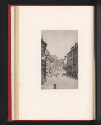 Photographic reproduction of a print of a street in Nuremberg with the portal of the meat market on the left