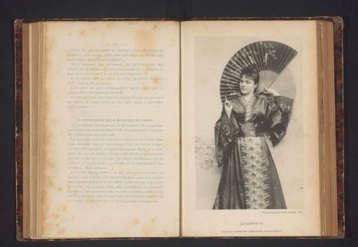 Portrait of an unknown young woman in a kimono with a fan