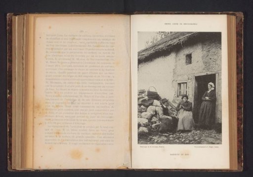 Two Unknown Women and an Unknown Man in Front of a Building