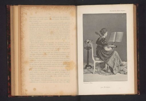 Portrait of an unknown woman playing the guitar
