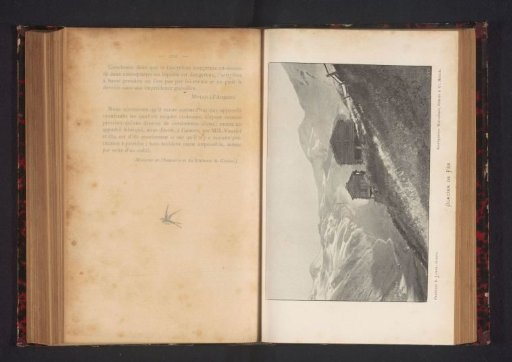 View of two buildings in front of the Fee glacier in the Swiss Alps