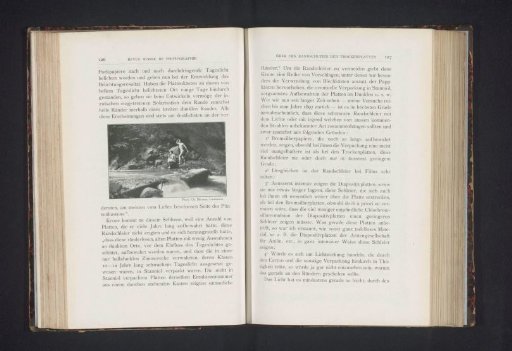 View of two naked men by a river