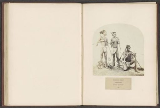 Three unknown men with a bow and arrow from the Korwa tribe of Chota Nagpur in eastern India