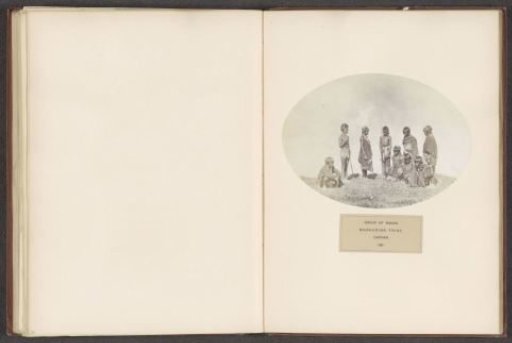 Nine men and women with spears from the Naga tribe of Assam