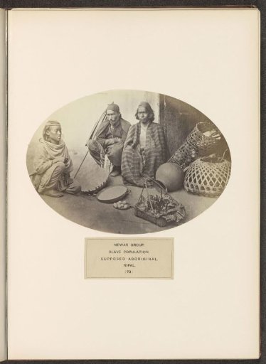 Three unknown men sitting on the ground from the Newar community of Nepal