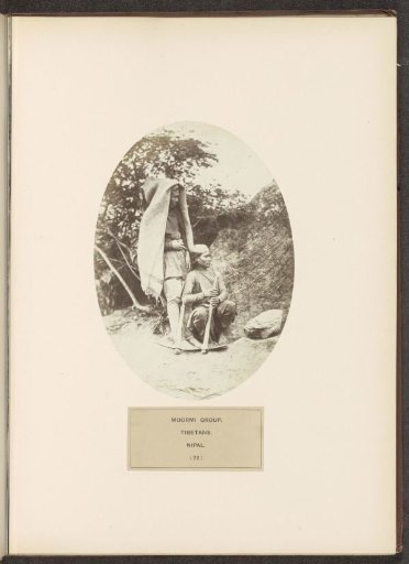 Two Unknown Men in Front of a Rock from the Moormi Community of Nepal