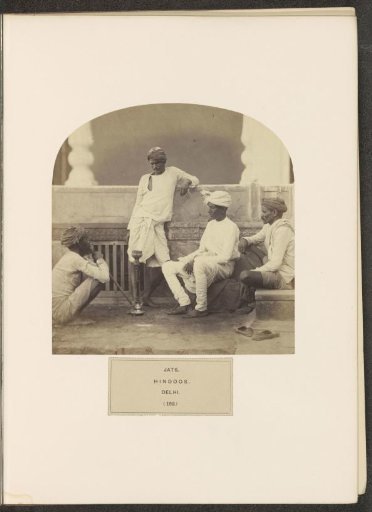 Four men from the Jat community with a waterpipe in Delhi, India