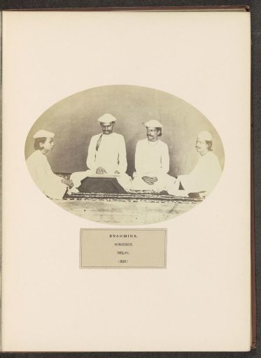 Four brahmins (Hindu priests) sitting on the ground in Delhi, India